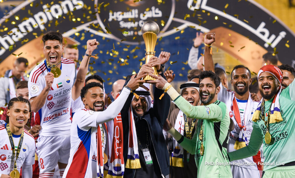 Sharjah FC (UAE) players lift the winners trophy after winning the match between Al Gharafa (QAT) and Sharjah FC (UAE) in the final of the Qatar UAE Super Cup 2026 played at Thani bin Jassim Stadium Doha, Qatar on 22 January, 2026. (Photo by Renjith Raju/QFootLive)